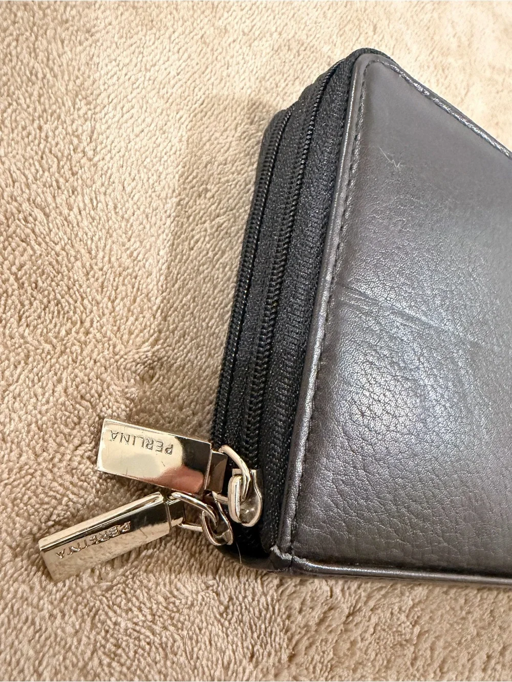 Perlina Black Leather Zip-Around Wallet with Metal Logo